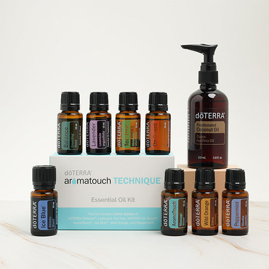 Set of eight doTERRA AromaTouch oils along with coconut oil, prepared for a soothing energetic massage with aromatherapy, designed to boost or relax the recipient in a calming atmosphere.